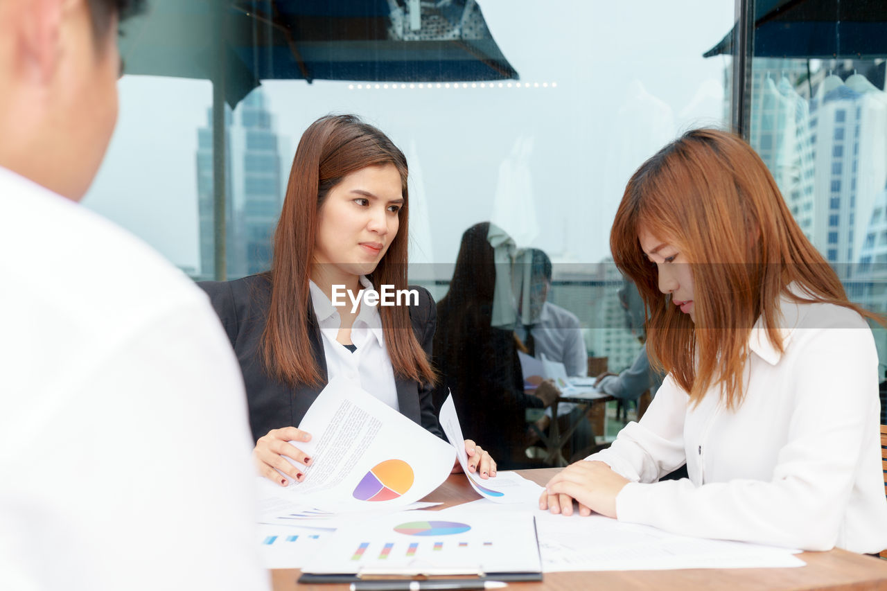 Business people working at desk in office