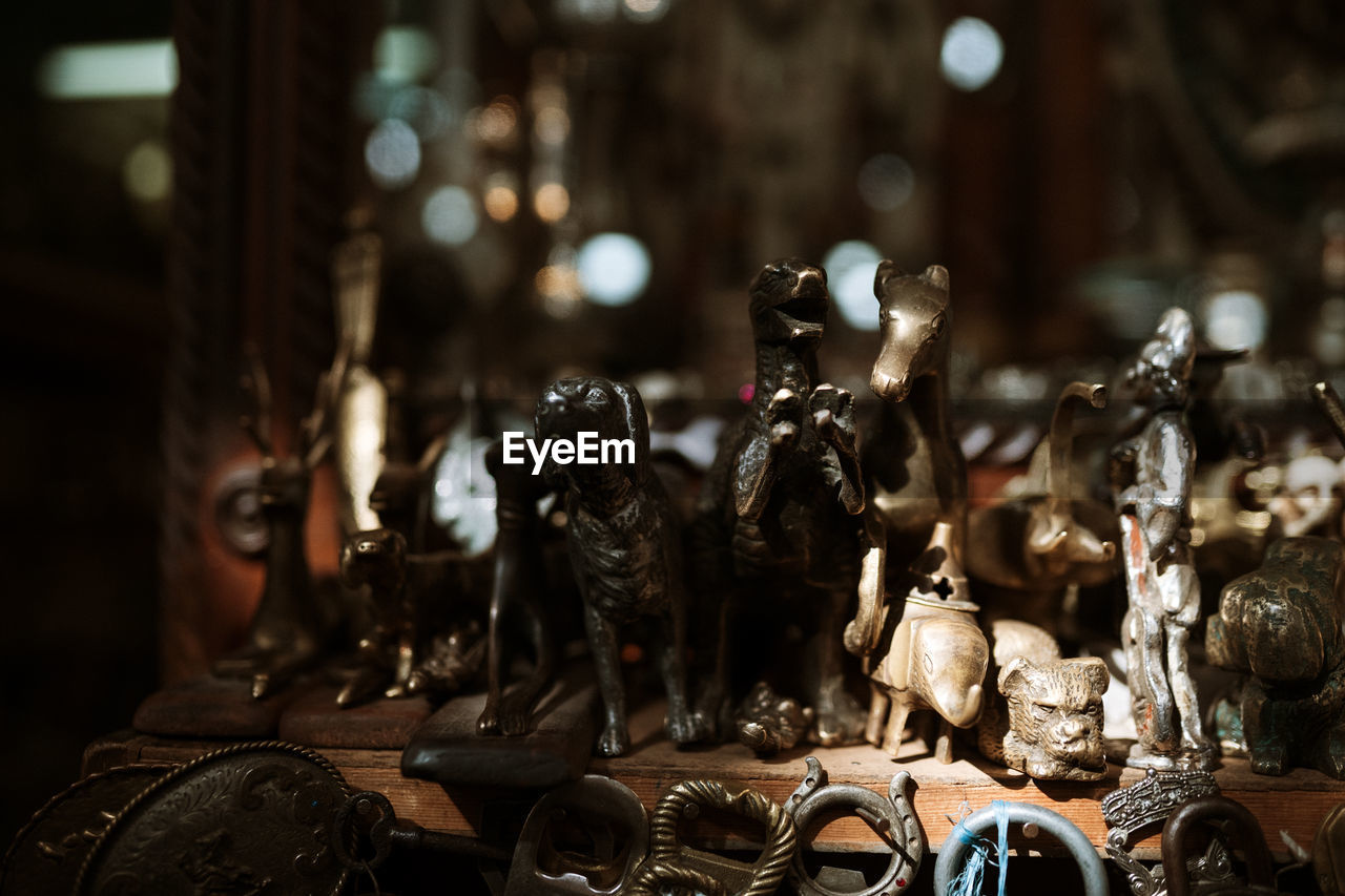 Close-up of old figurines on table