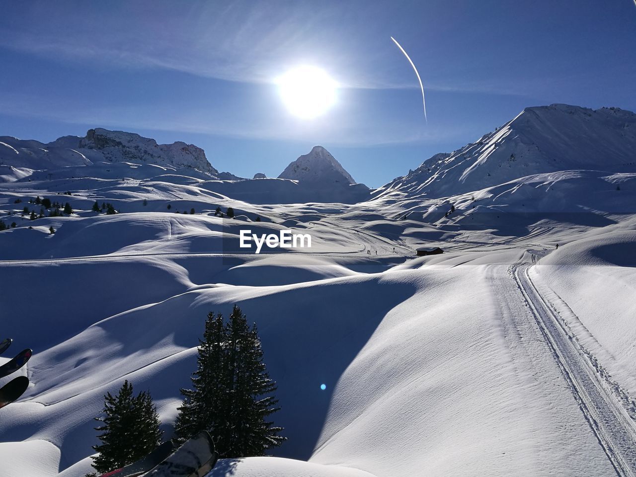 Scenic view of snow covered mountains against sky