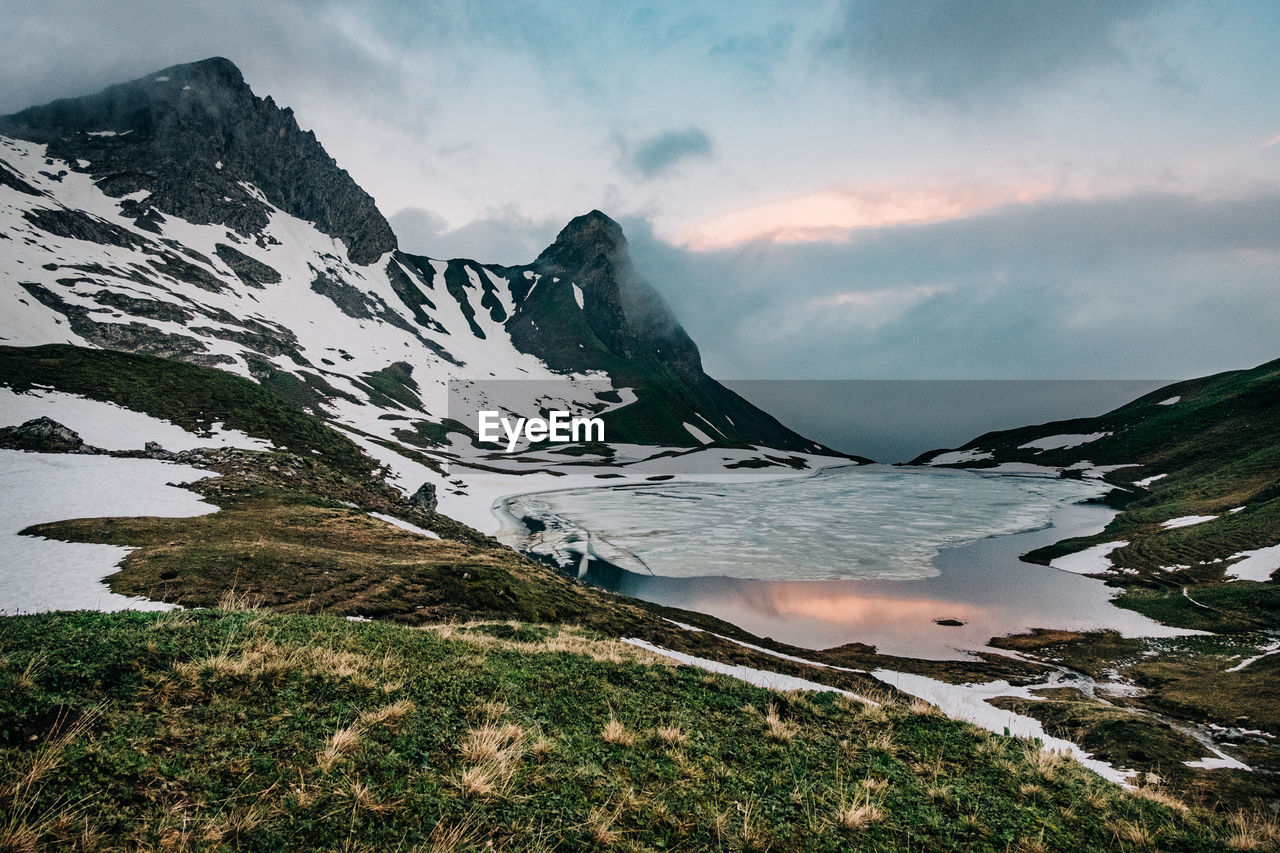 Landscape picture of rappensee with snow during sunrise 