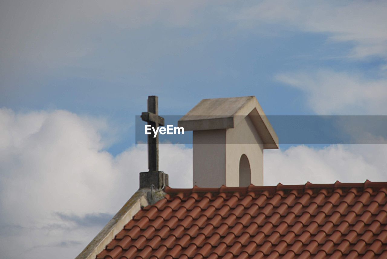 Low angle view of roof of building against sky