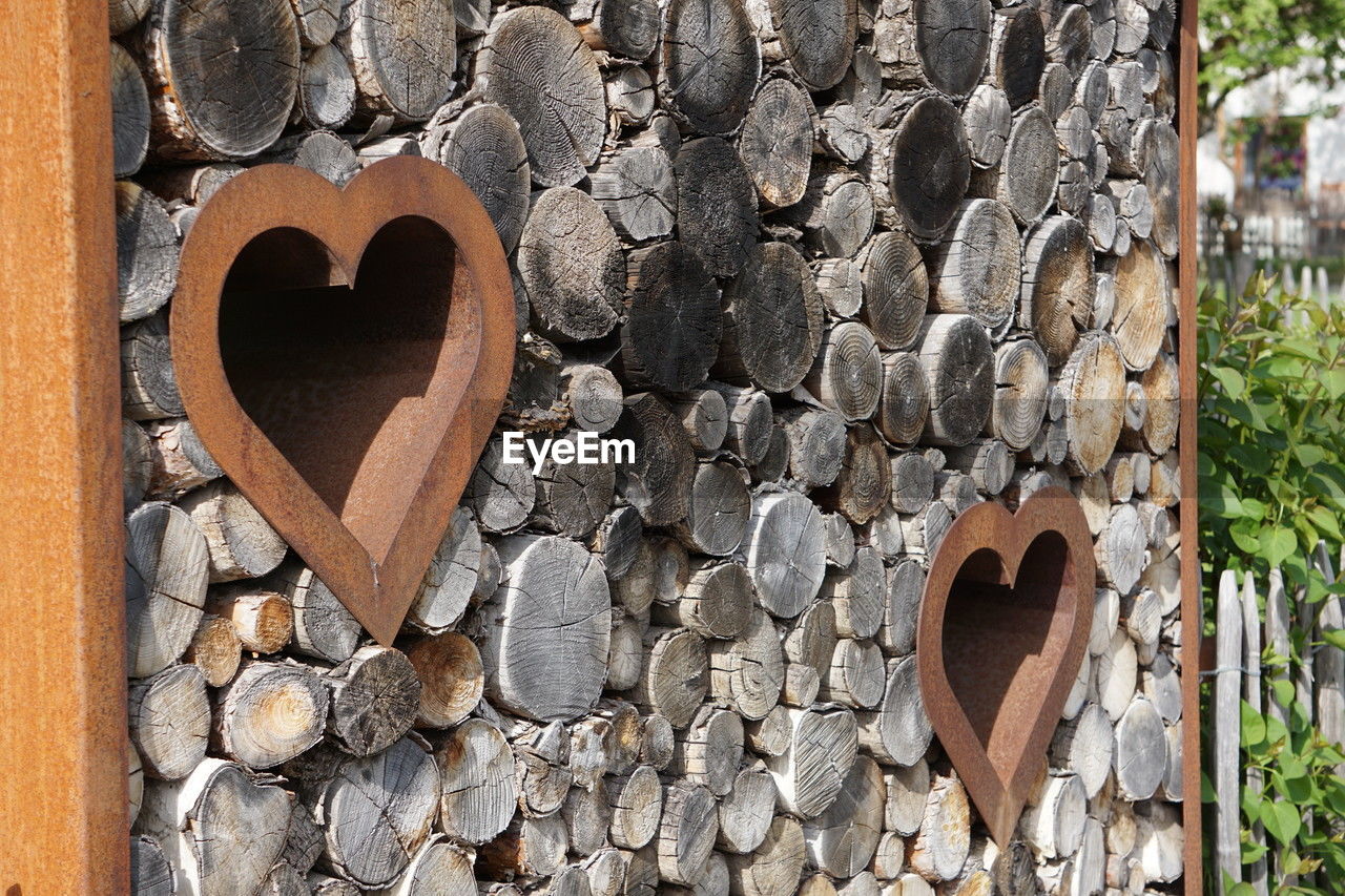 wood, heart shape, love, positive emotion, tree, day, no people, wall, nature, emotion, outdoors, rock, iron, leaf, plant, shape, close-up, soil, textured
