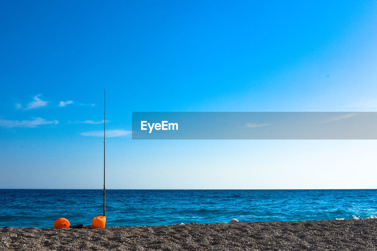 Scenic view of sea against blue sky