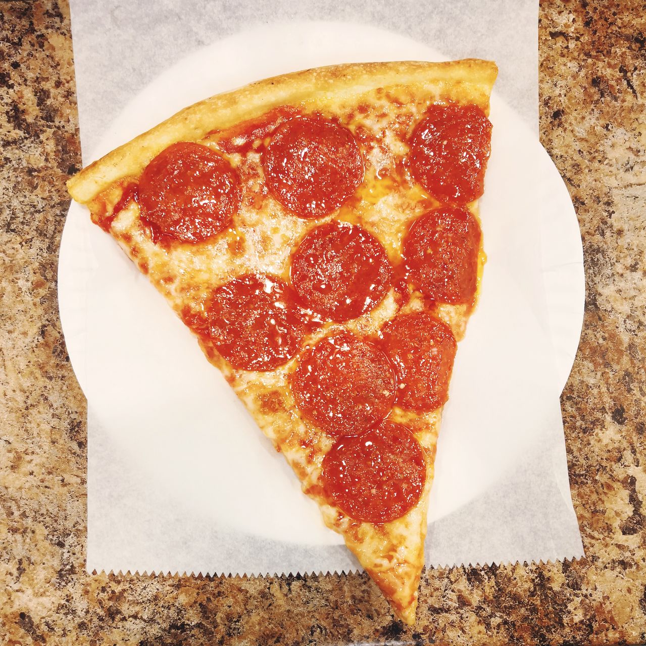 High angle view of pizza in plate on table