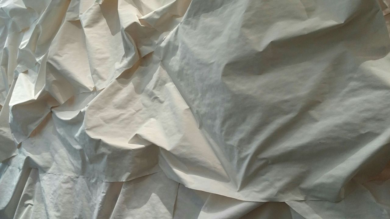 Full frame shot of white crumpled fabric