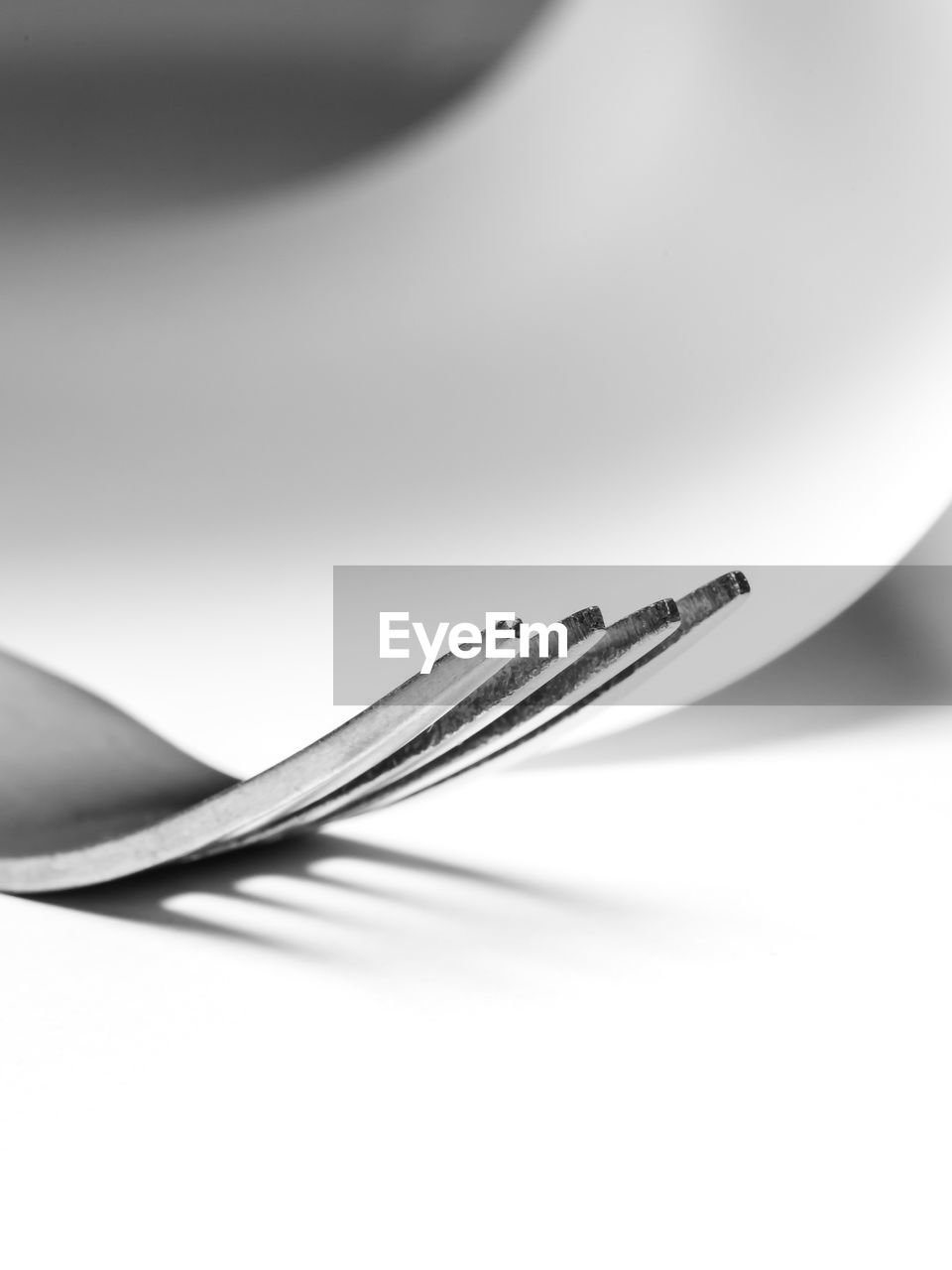 Close-up of fork on white background