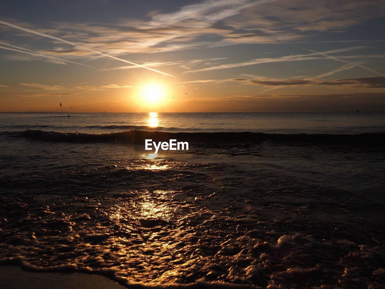 Scenic view of sea against sky during sunset