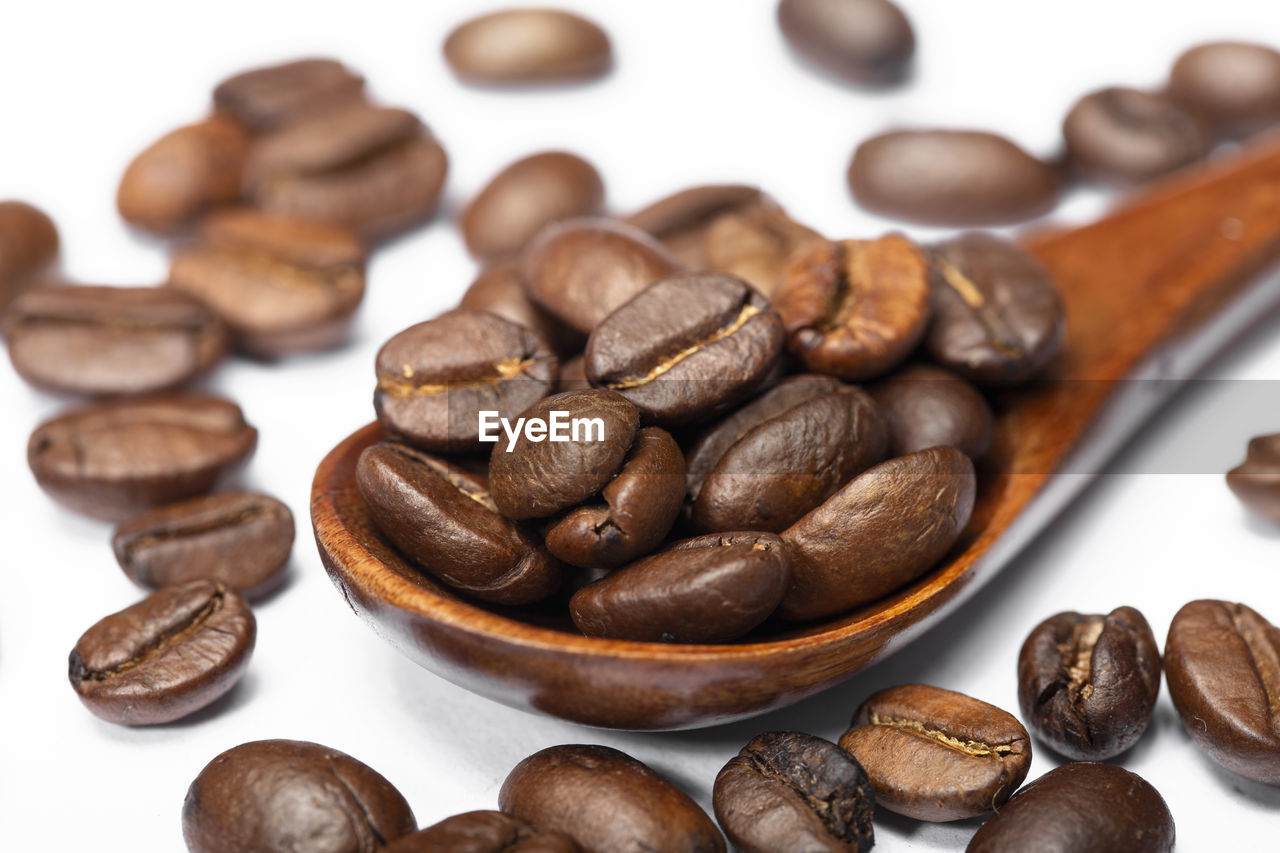 CLOSE-UP OF COFFEE BEANS IN GLASS