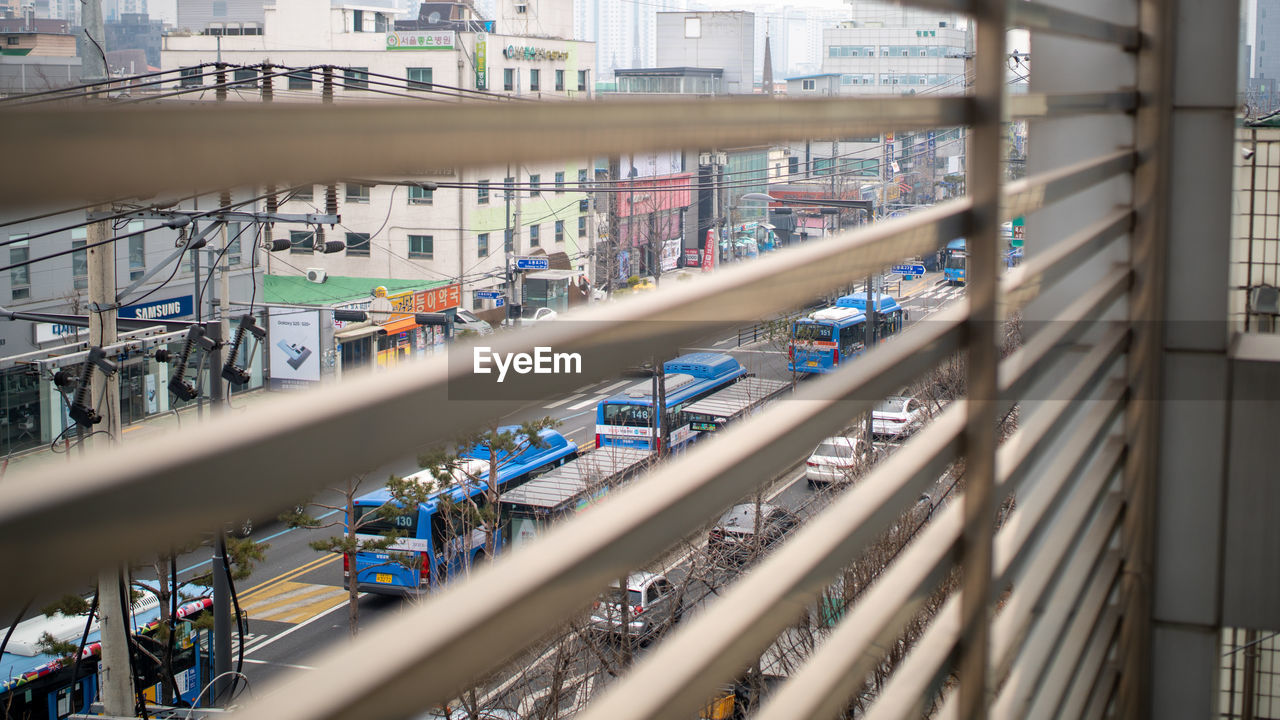 HIGH ANGLE VIEW OF BUILDING SEEN THROUGH BALCONY