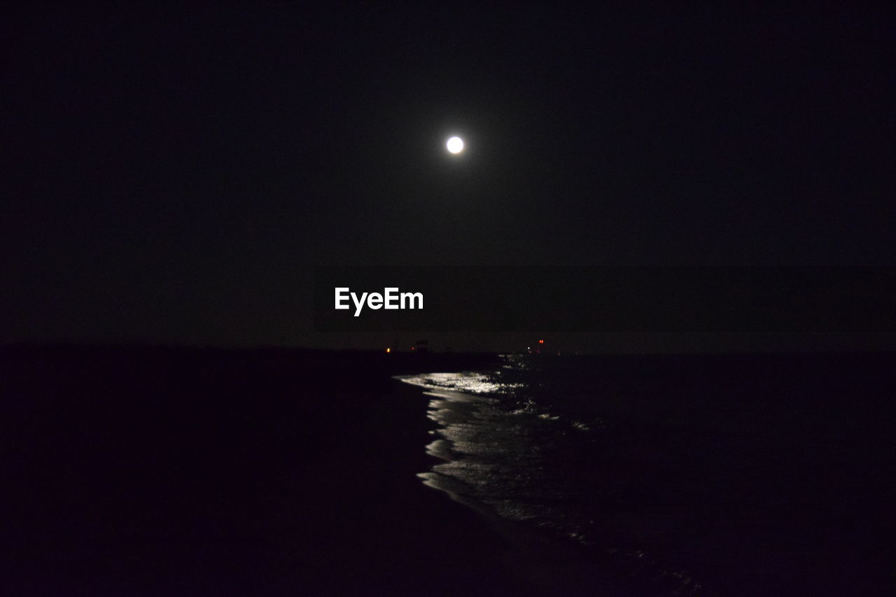 SCENIC VIEW OF SEA AGAINST MOON IN SKY