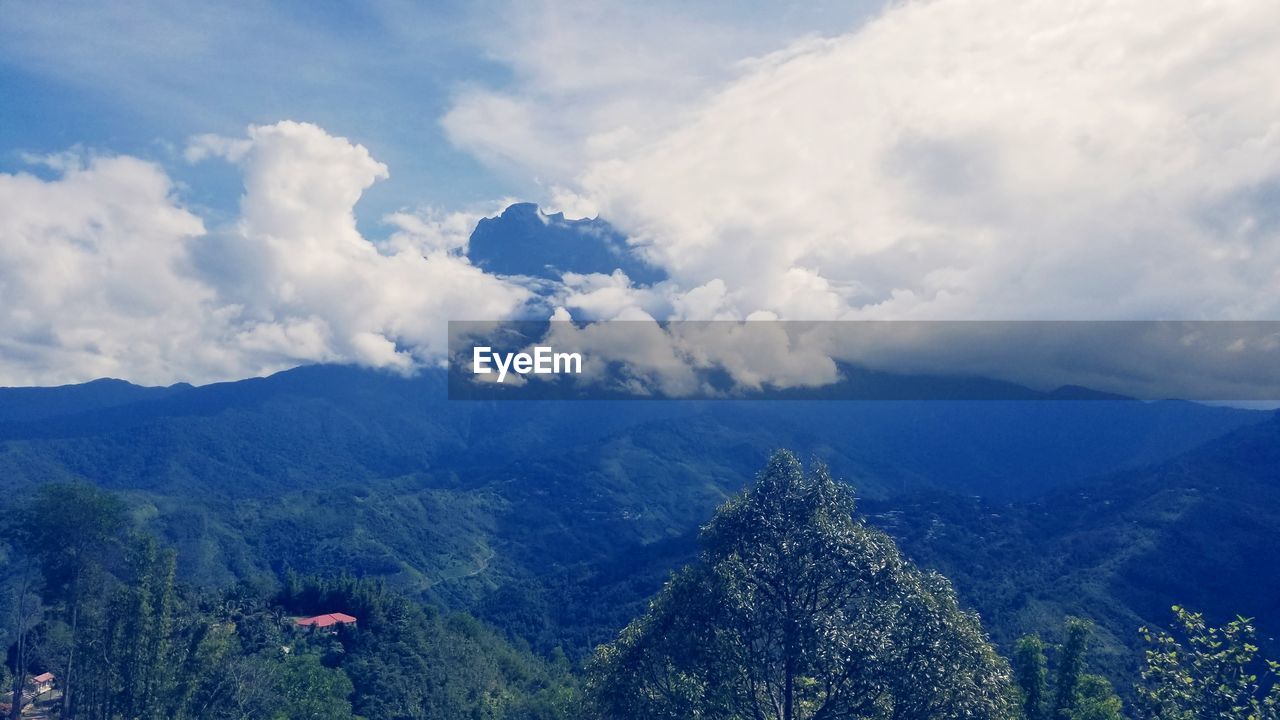 AERIAL VIEW OF MOUNTAINS AGAINST SKY
