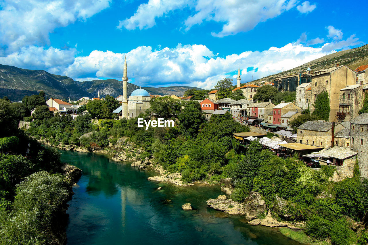 High angle view of river amidst buildings in town