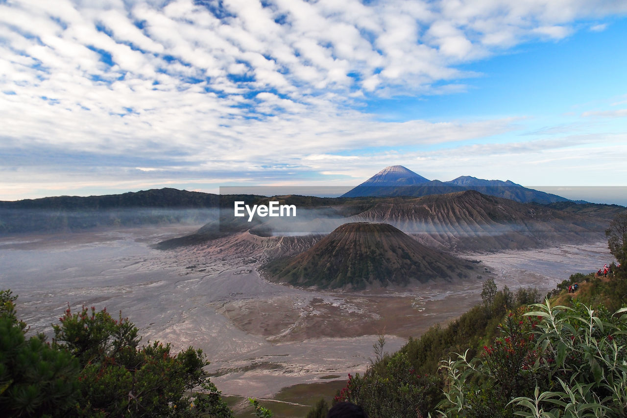 View of landscape against cloudy sky