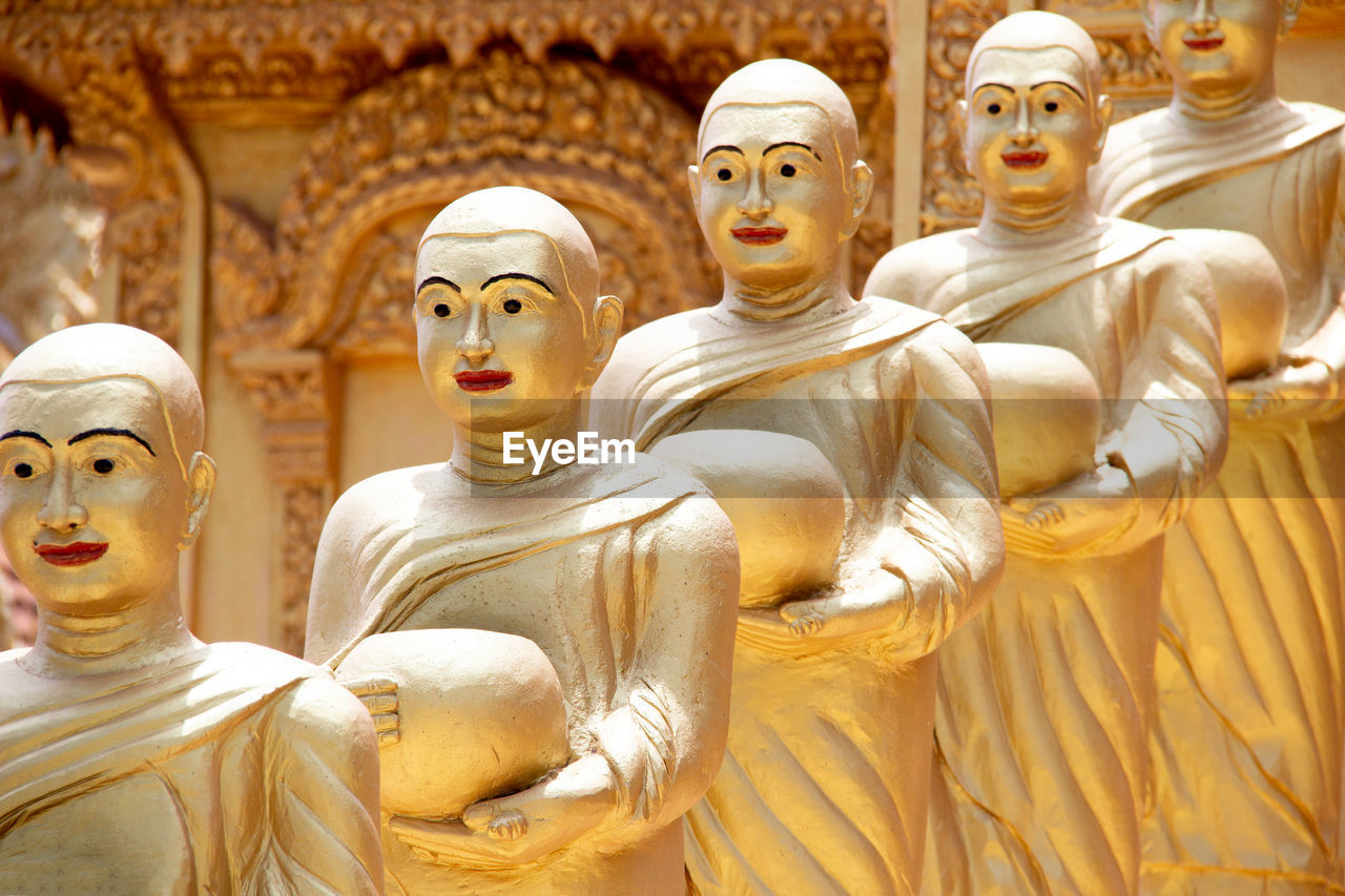 Buddha statues in row