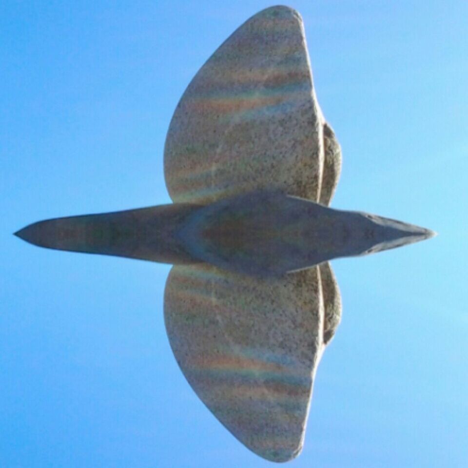 LOW ANGLE VIEW OF STATUES AGAINST CLEAR BLUE SKY