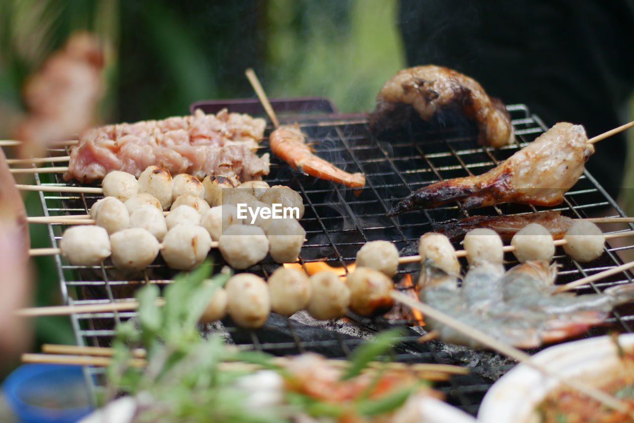 Close-up of meat on barbecue grill