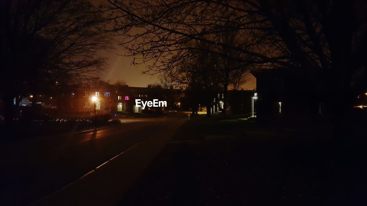 ROAD PASSING THROUGH ILLUMINATED PARK