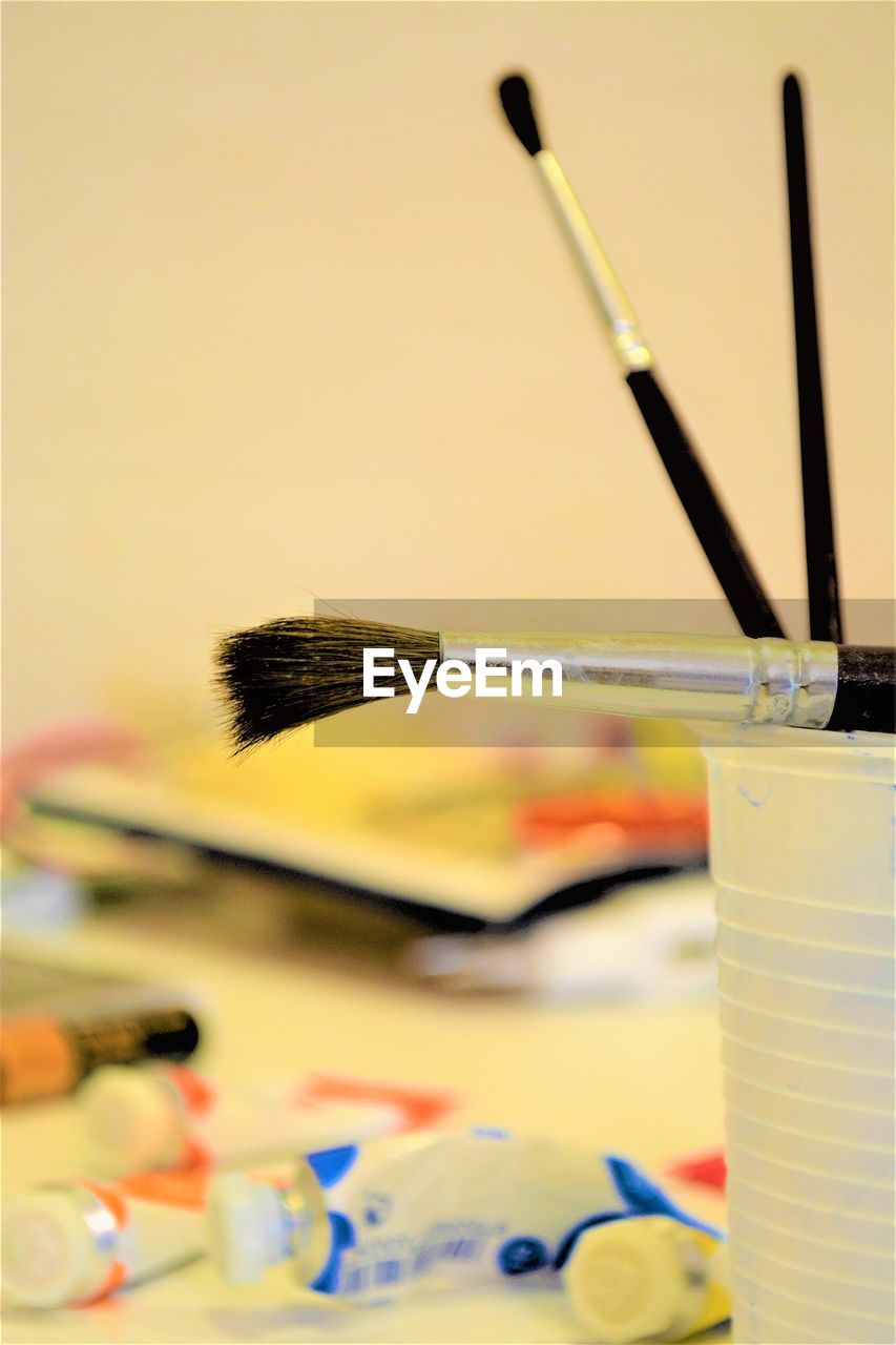 Close-up of paintbrushes on table