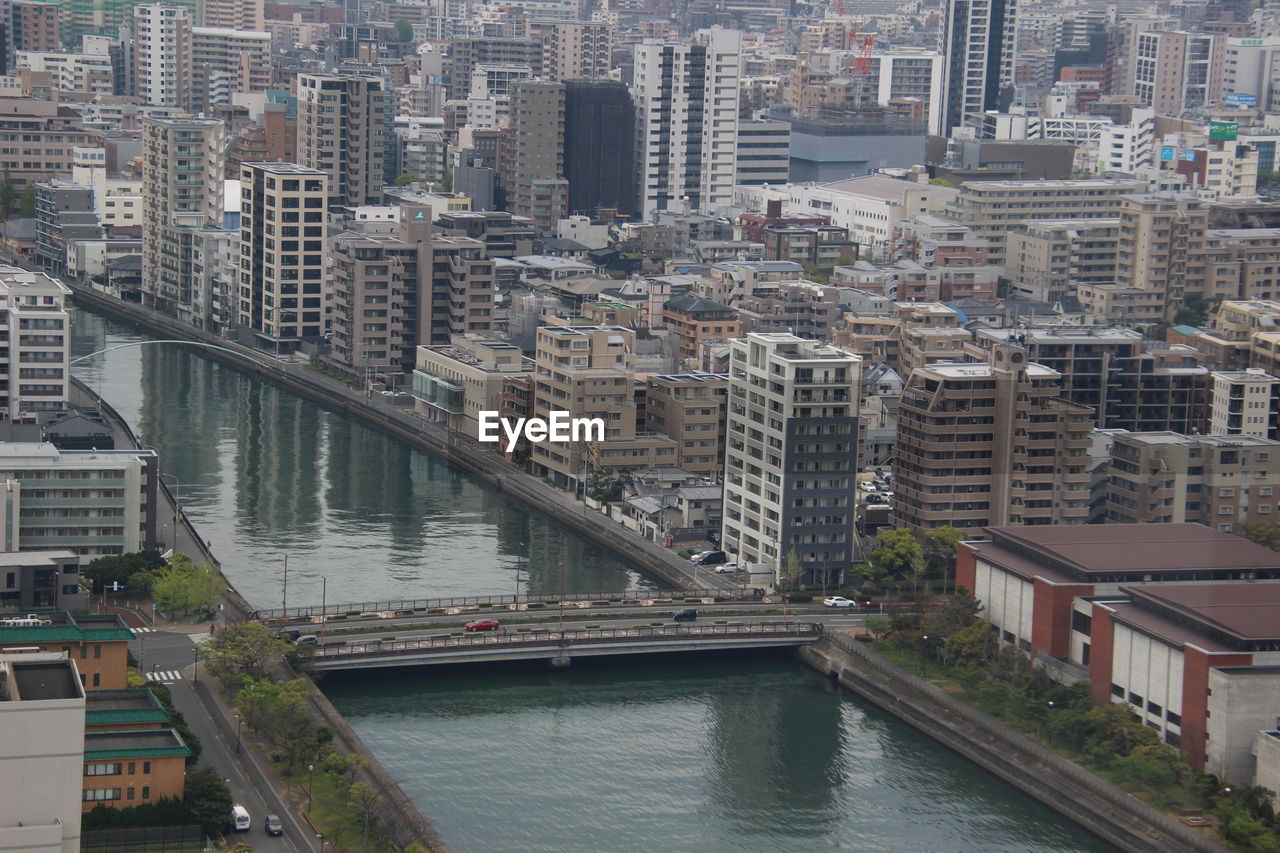 High angle view of river amidst buildings in city