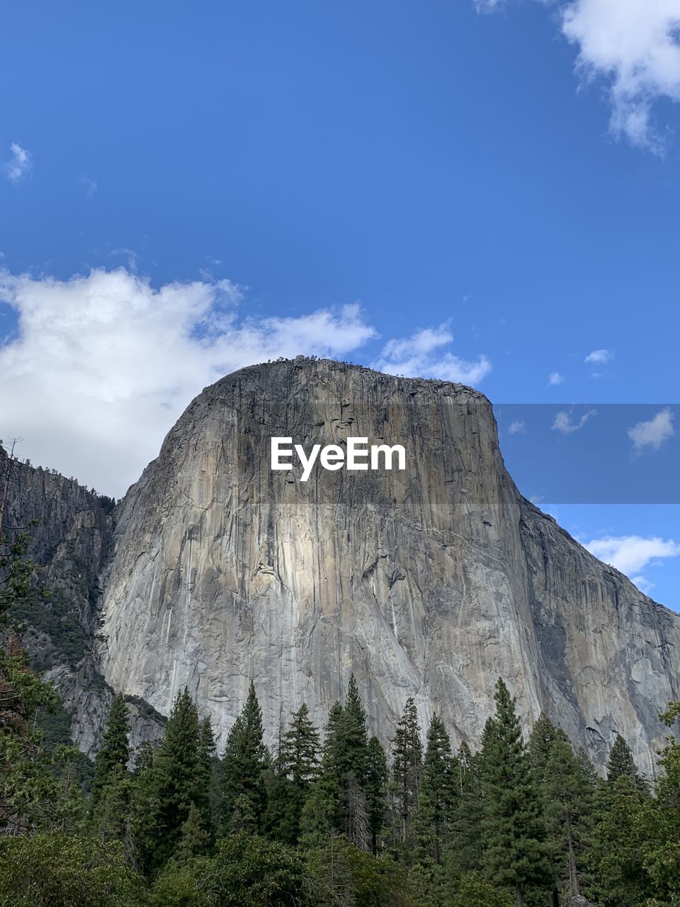 Low angle view of rocky mountain against sky