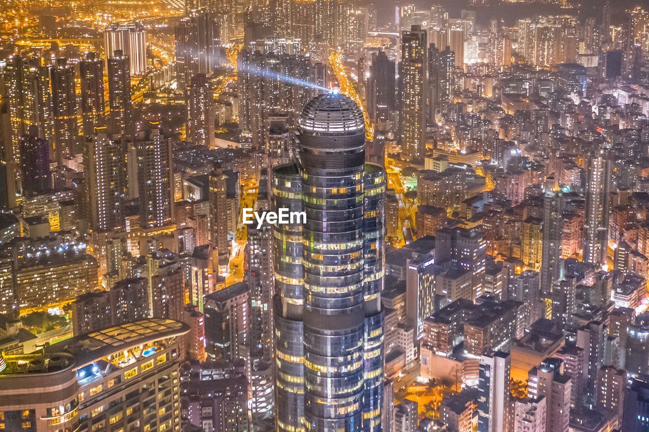 Aerial view of illuminated buildings in city at night