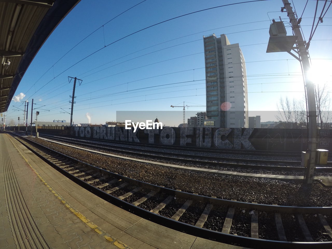 VIEW OF RAILWAY TRACKS AGAINST SKY