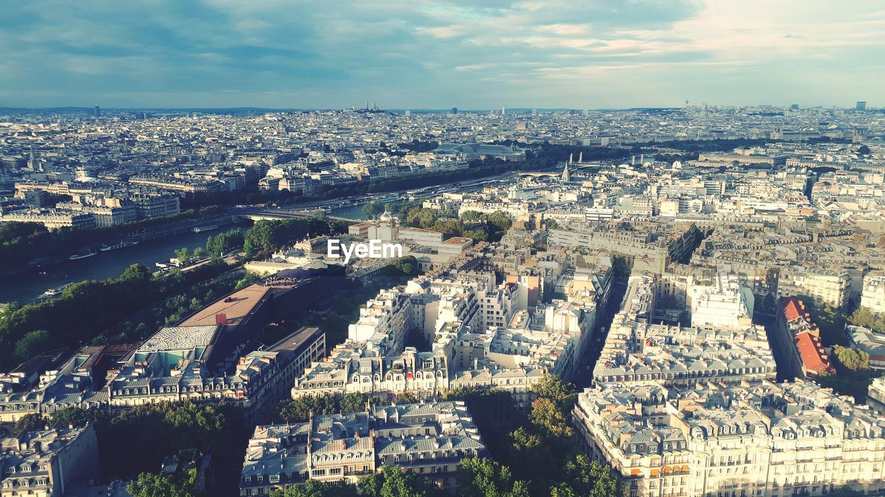 HIGH ANGLE VIEW OF CITY BUILDINGS AGAINST SKY