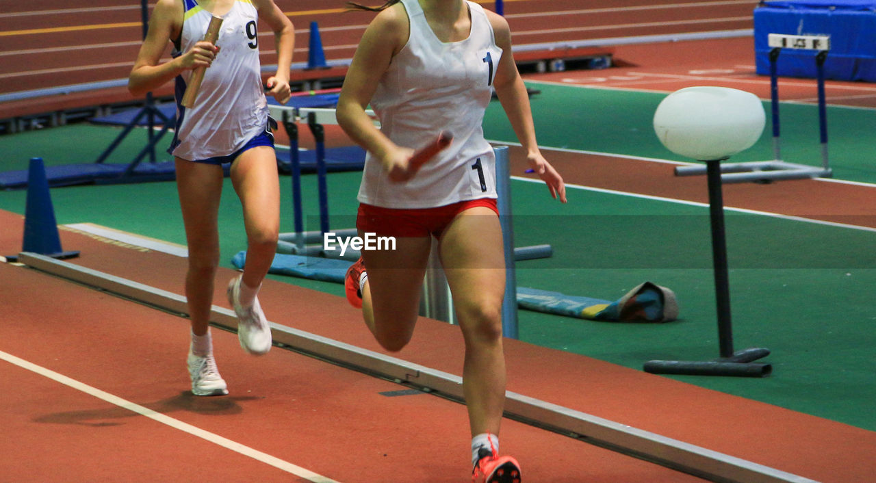 sports, athlete, competition, women, young adult, adult, lifestyles, exercising, clothing, track and field event, competitive sport, running track, sports clothing, motion, sprinting, group of people, activity, determination, sports equipment, person, hurdle, running, footwear, leisure activity, sports track