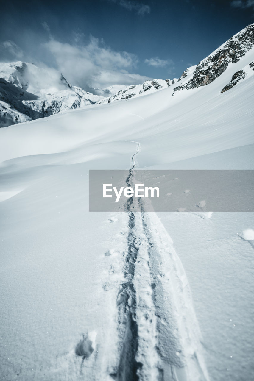 Ski tracks in alpine winter wonderland landscape, austrian alps, gastein, salzburg, austria