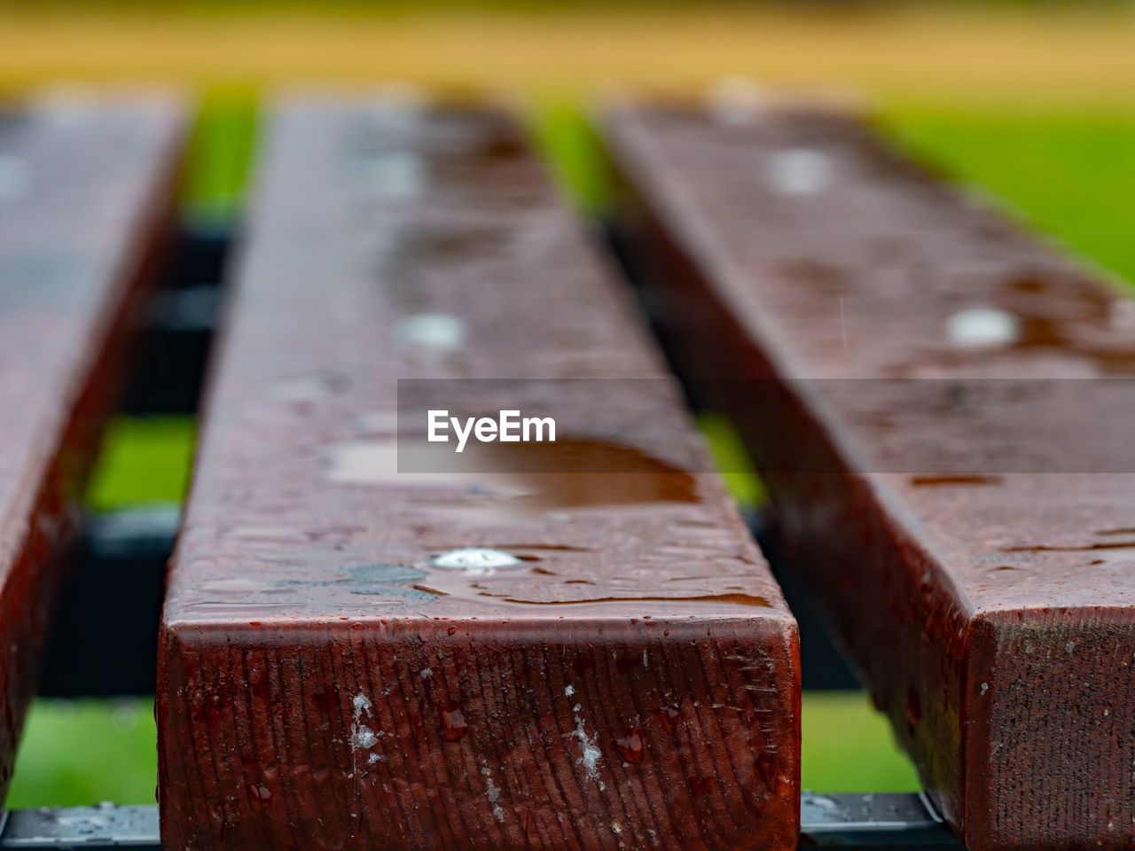 Water drops on a dark wooden background closeup. oiled wooden planks surface resistent to water drop