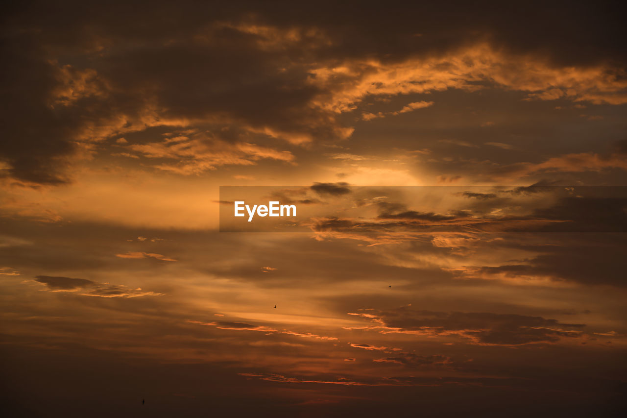 SCENIC VIEW OF DRAMATIC SKY DURING SUNSET