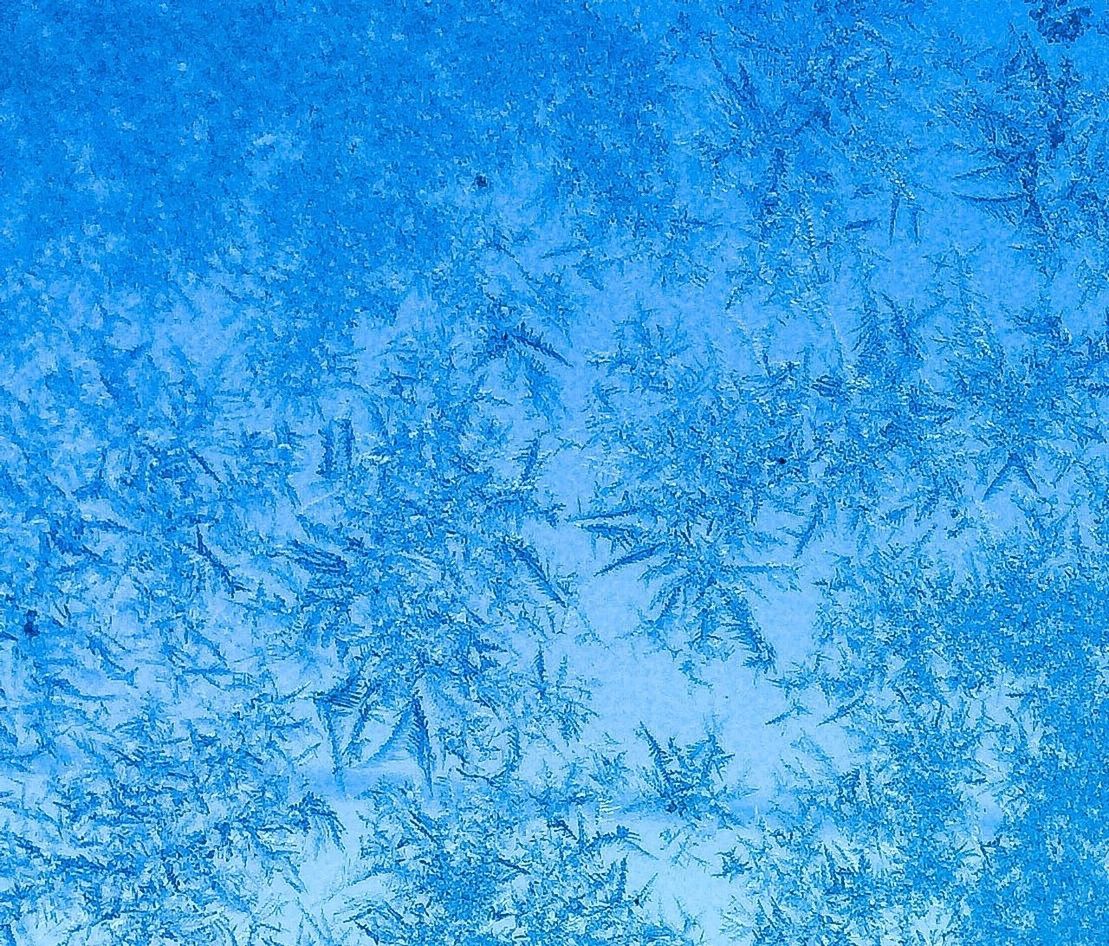 Full frame shot of ice crystals on glass window
