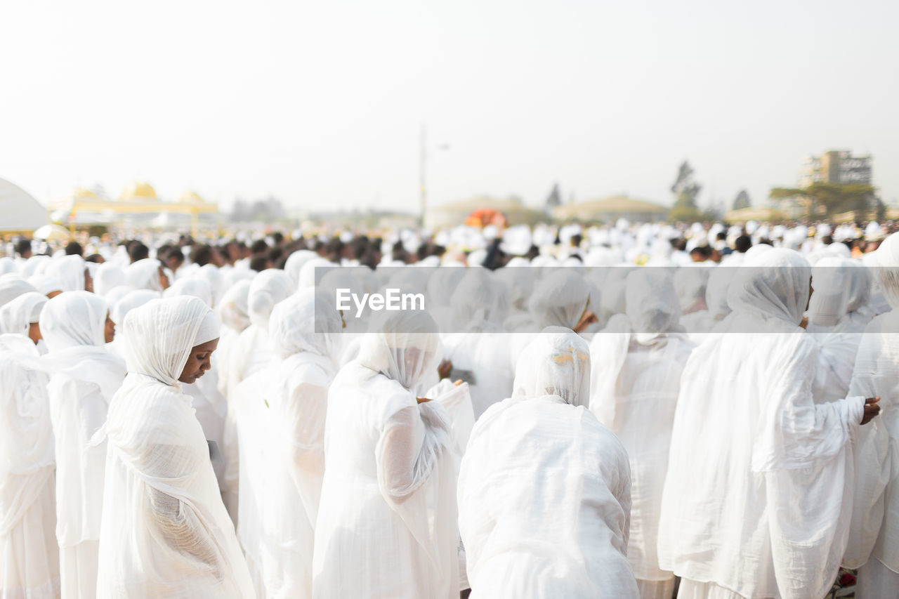 People praying in city