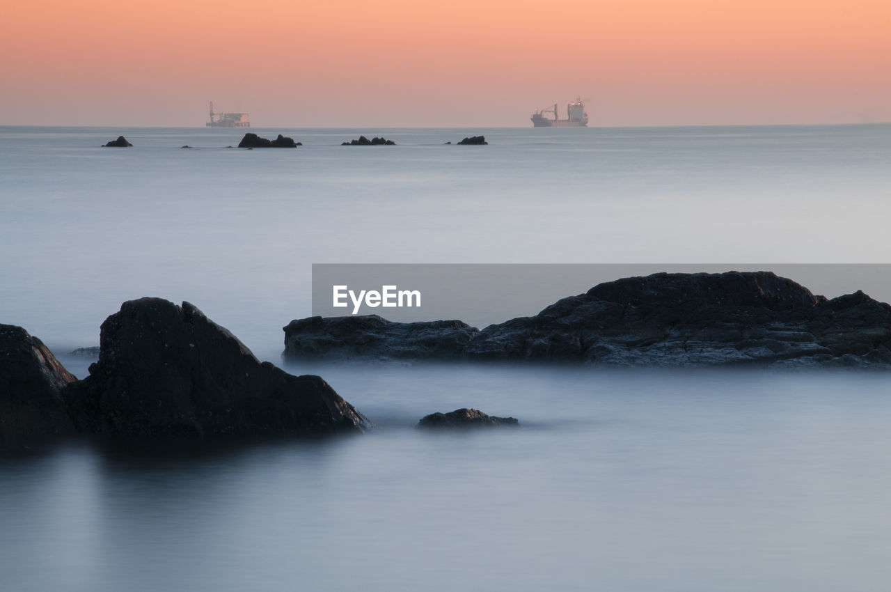 Scenic view of sea against sky during sunset