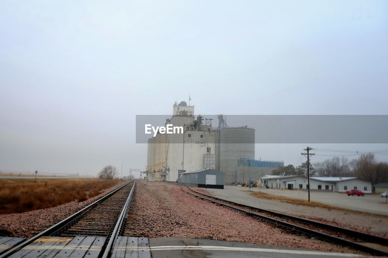 Buildings by railroad tracks