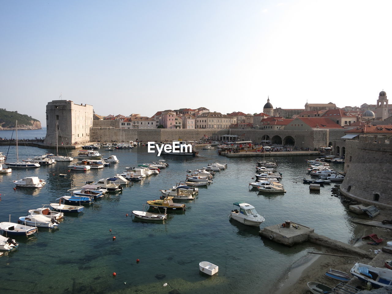 BOATS MOORED IN HARBOR