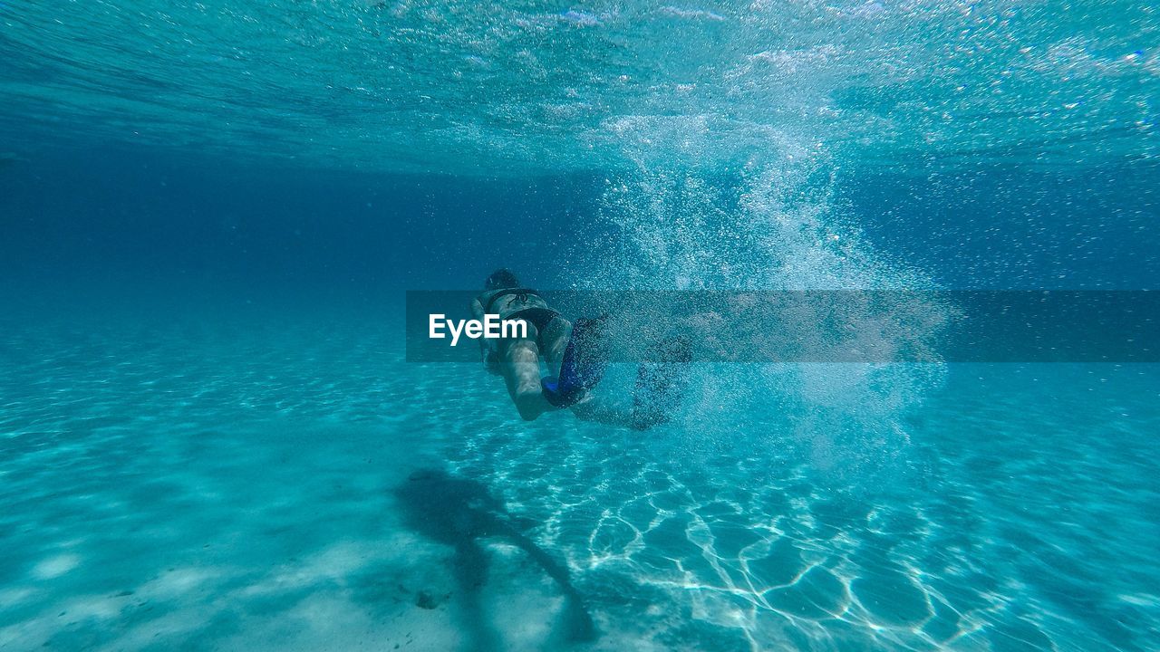 Woman swimming in sea