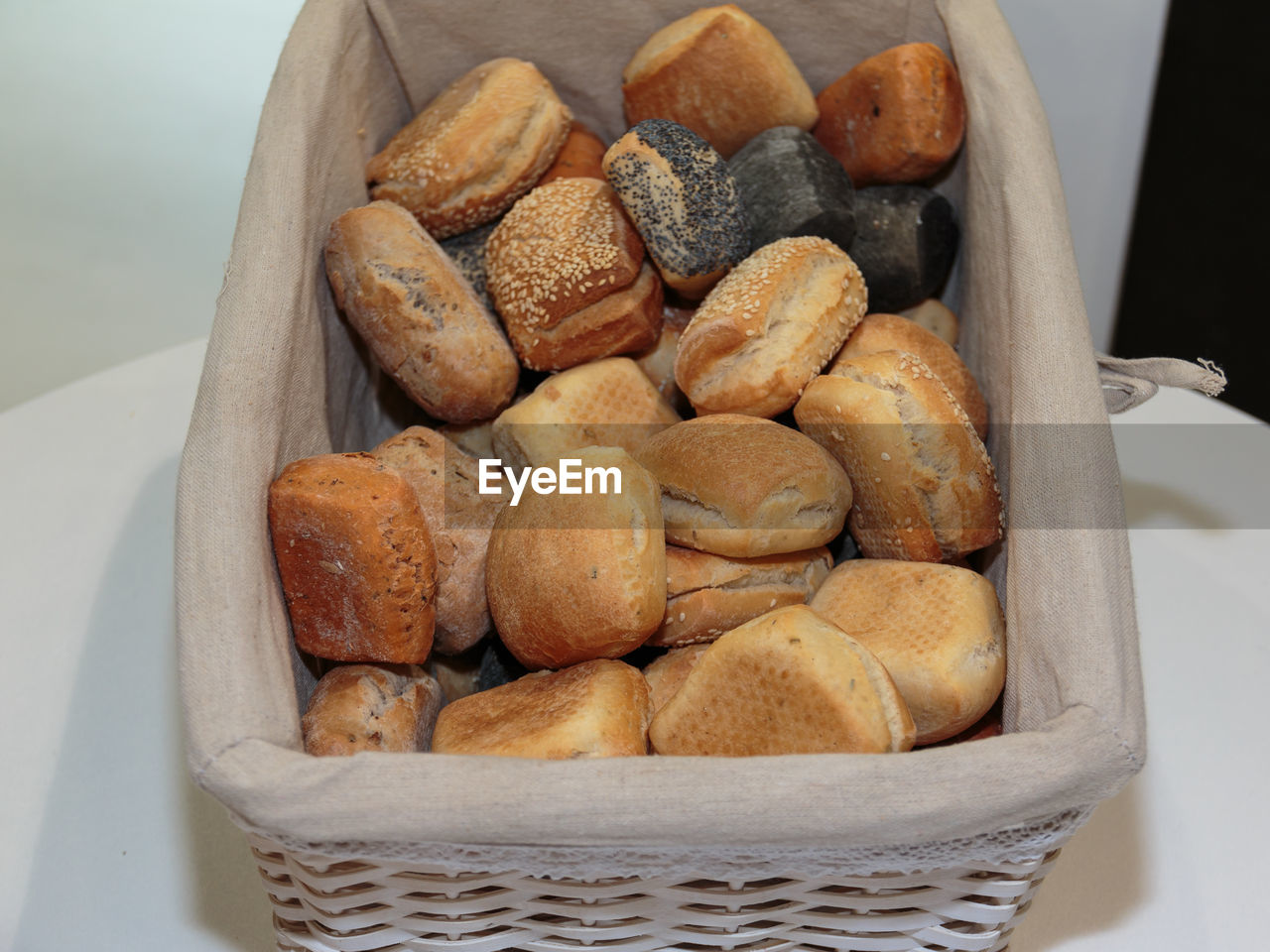 HIGH ANGLE VIEW OF BREAD IN WICKER BASKET