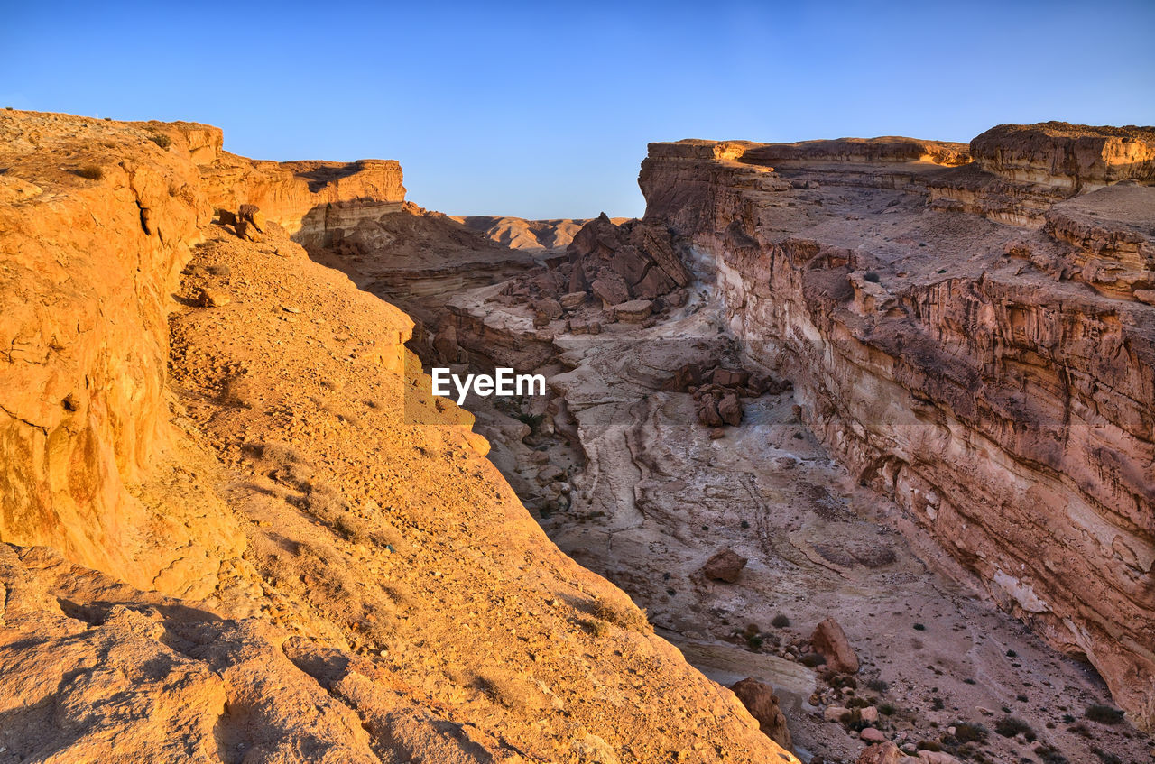 Scenic view of rocky mountains against clear sky