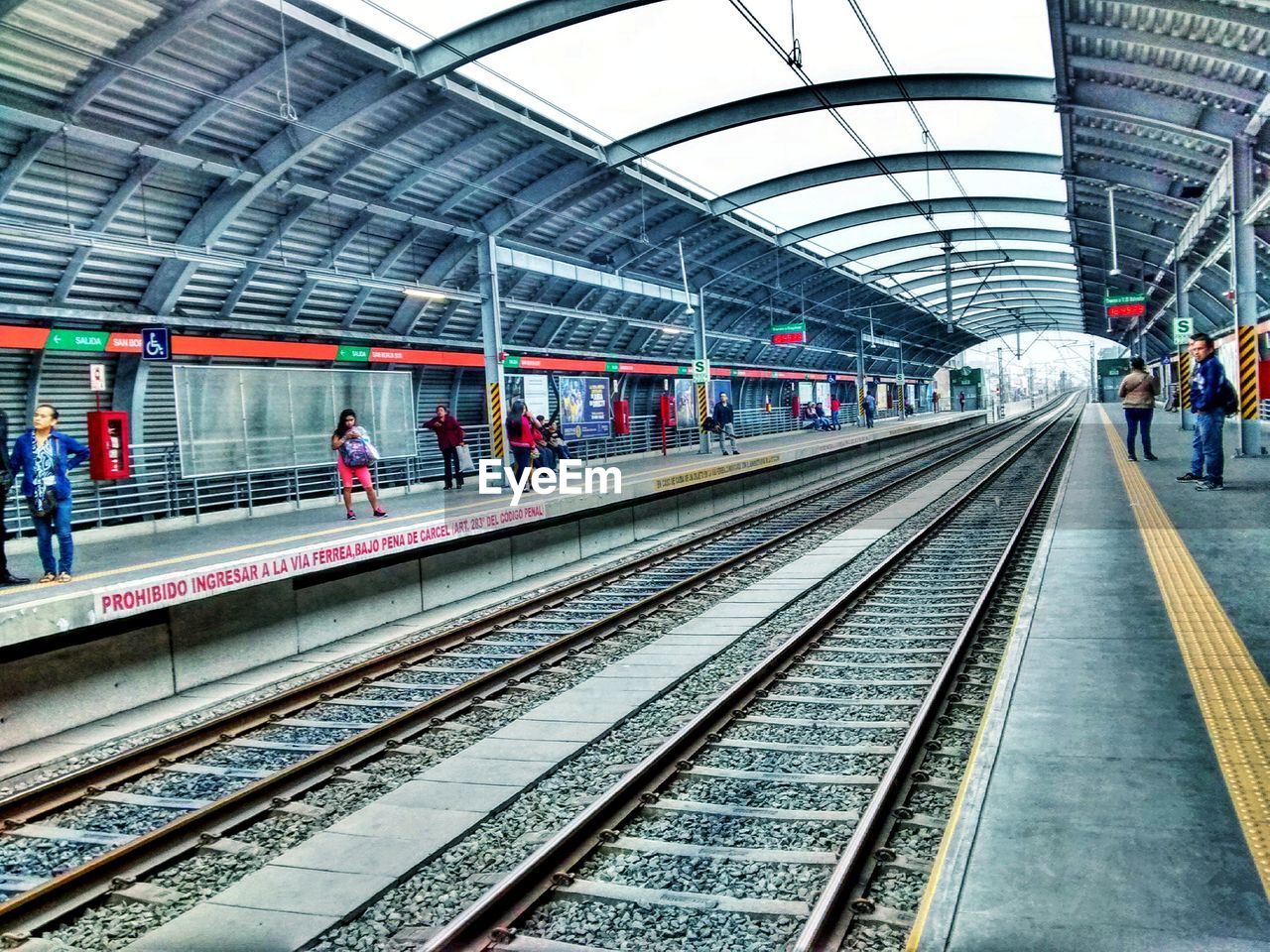 TRAIN ON RAILROAD STATION PLATFORM