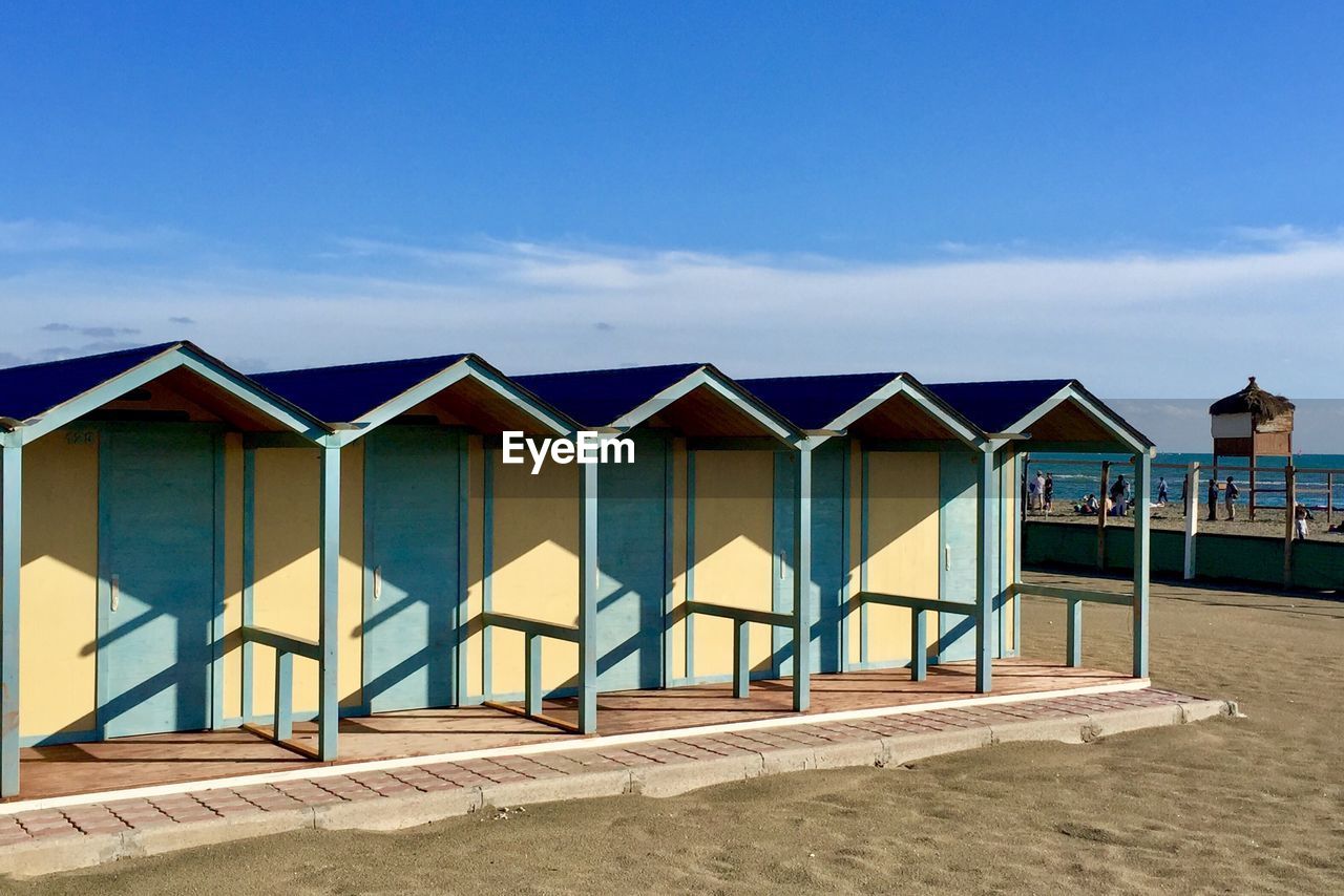 Wooden huts on sunny beach in italy