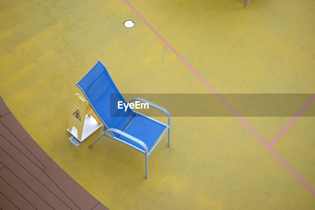 High angle view of blue chair on floor