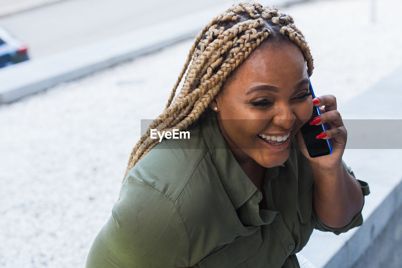 portrait of young woman using phone