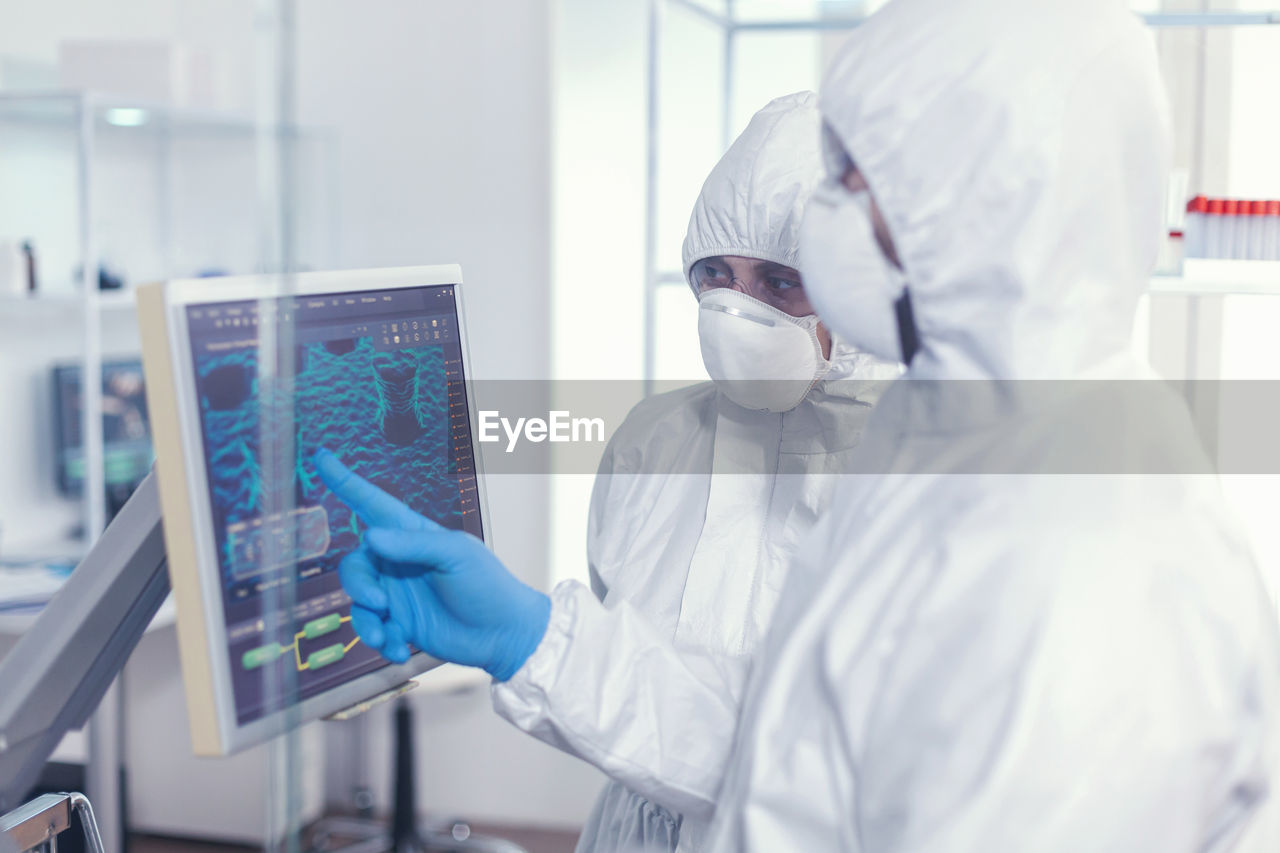 rear view of female scientist working in laboratory