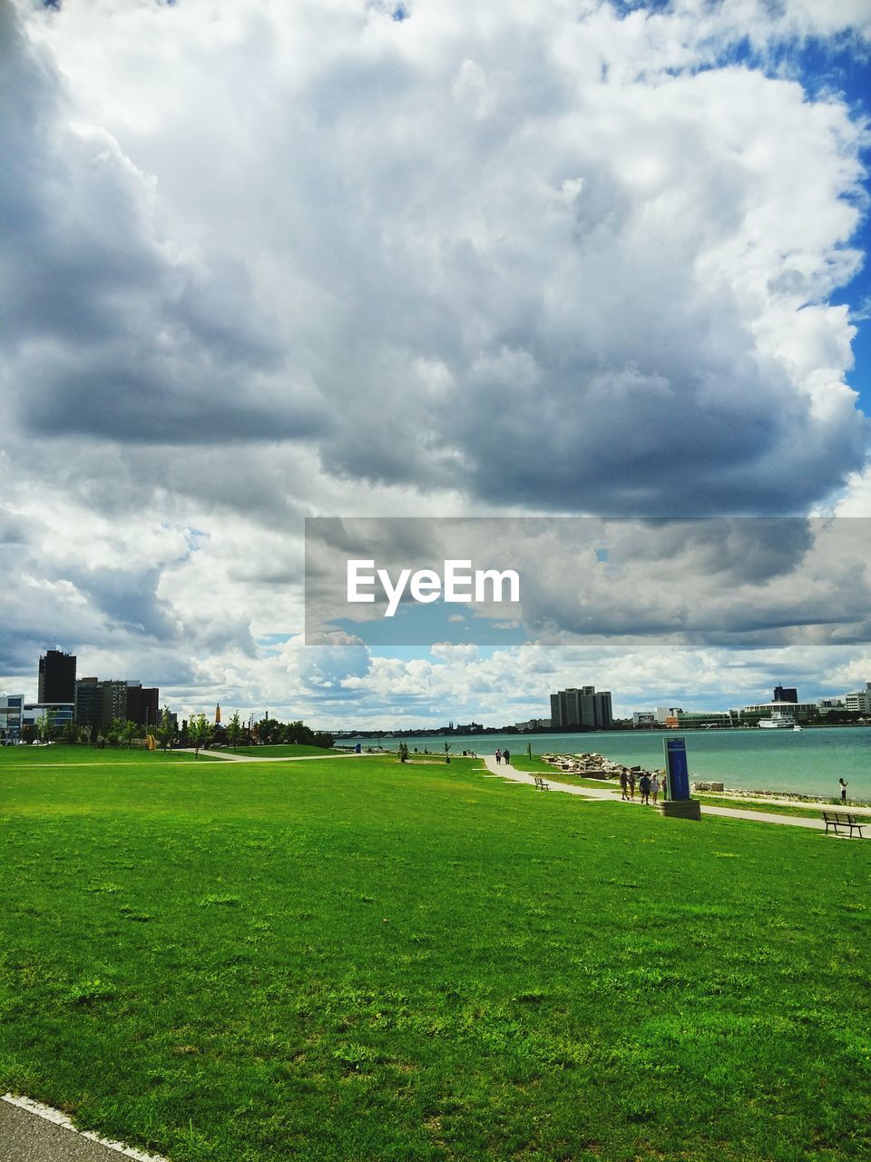 Scenic view of field against cloudy sky