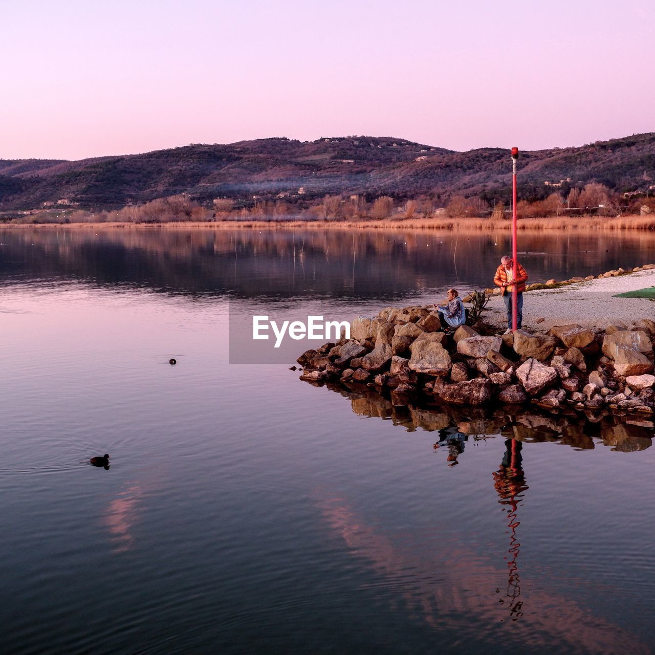 SCENIC VIEW OF LAKE AGAINST CLEAR SKY