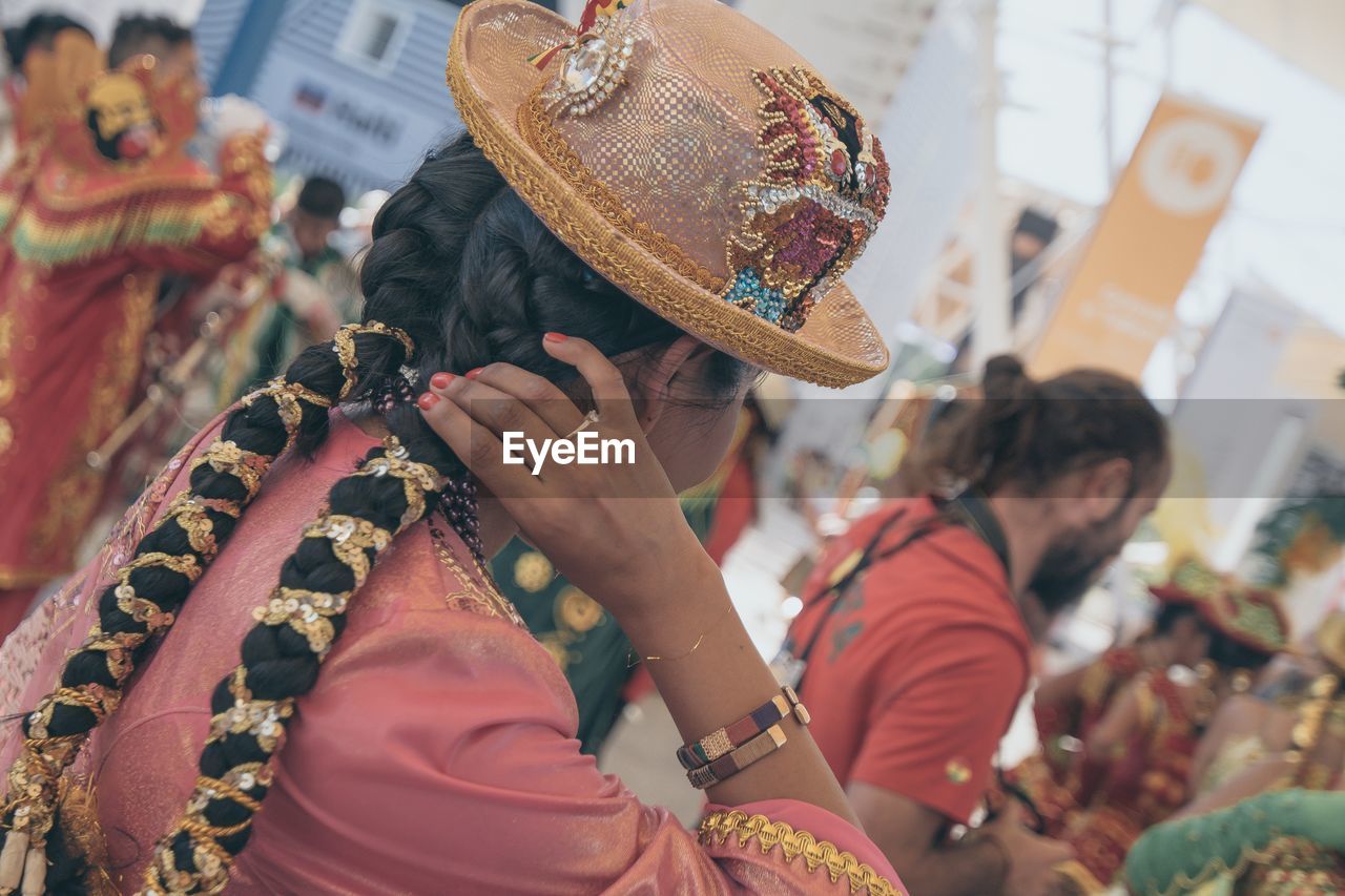 Close-up of woman wearing hat during carnival