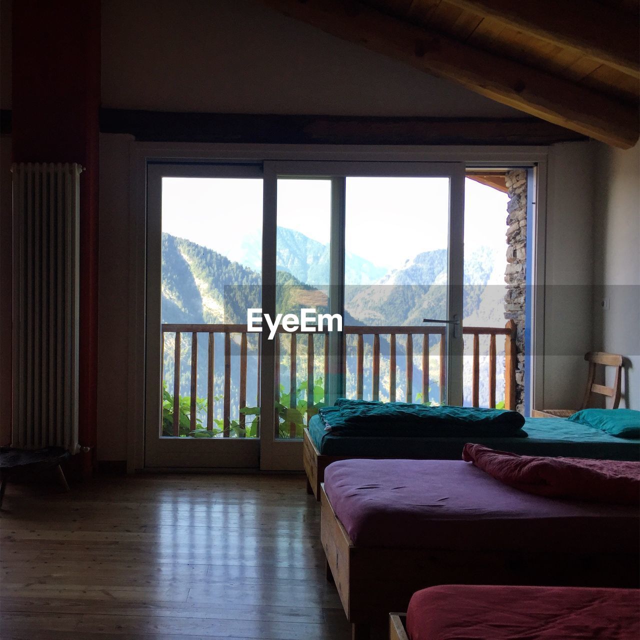 SCENIC VIEW OF HOME SEEN THROUGH WINDOW AT DUSK