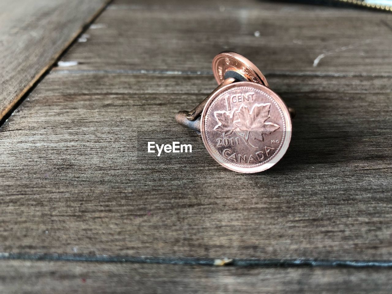 Close-up of cuff links on table