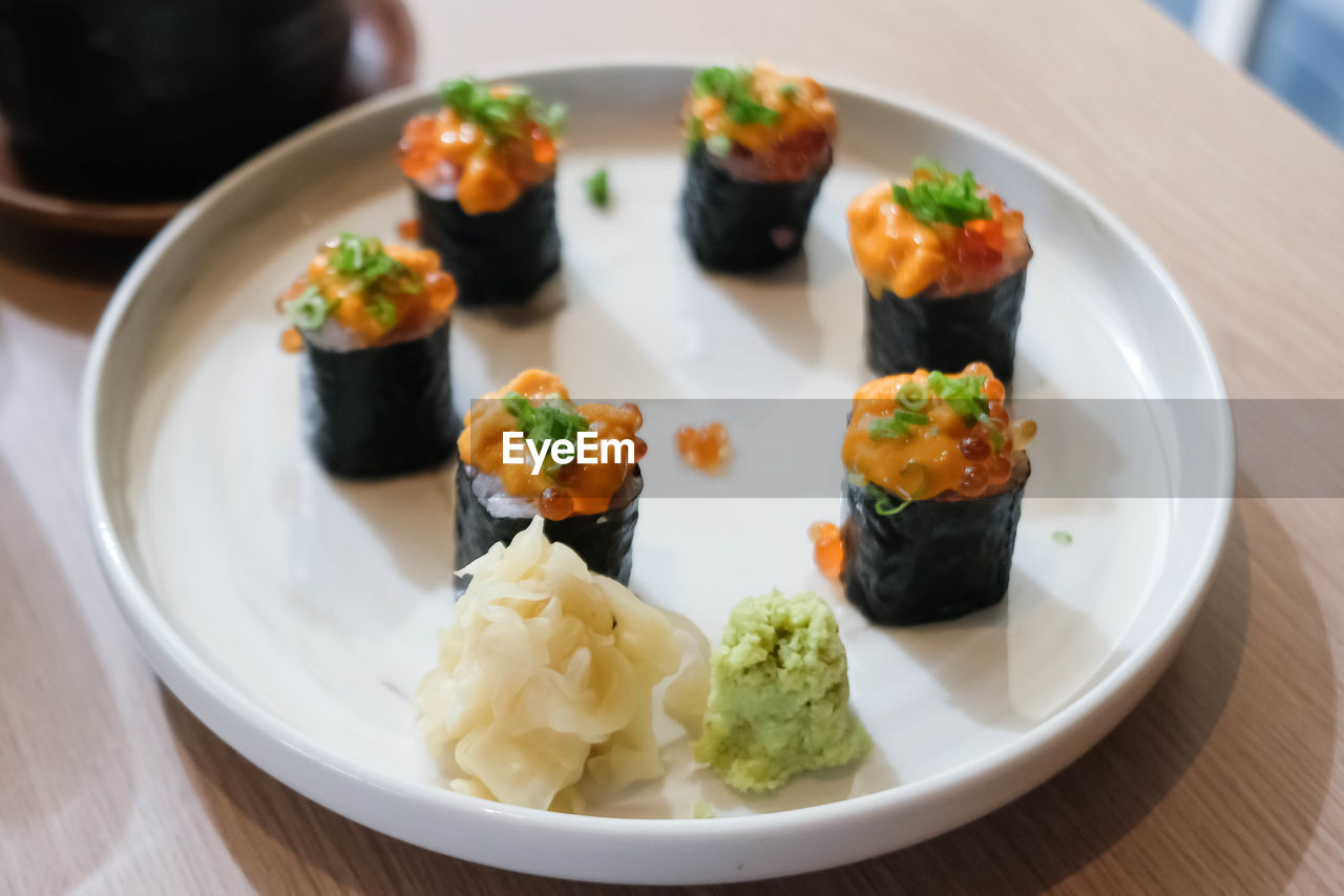 food and drink, food, healthy eating, asian food, seafood, cuisine, dish, plate, japanese food, freshness, wellbeing, culture, meal, sushi, no people, rice, table, indoors, close-up, appetizer, rice - food staple, vegetable, restaurant, gourmet, fish, focus on foreground, business, crockery, dinner
